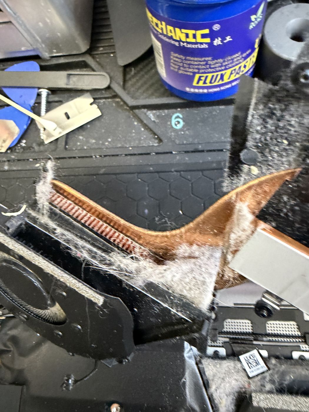 Board-level phone repair at the 2A Electronics microsoldering bench in Chicago