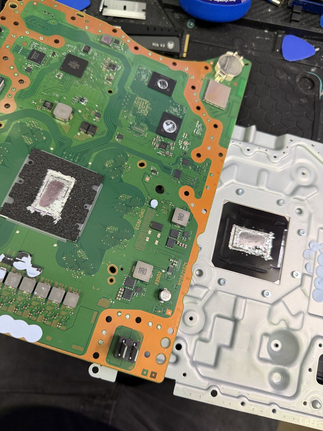 PlayStation motherboard heatsink removal and repair at 2A Electronics Chicago
